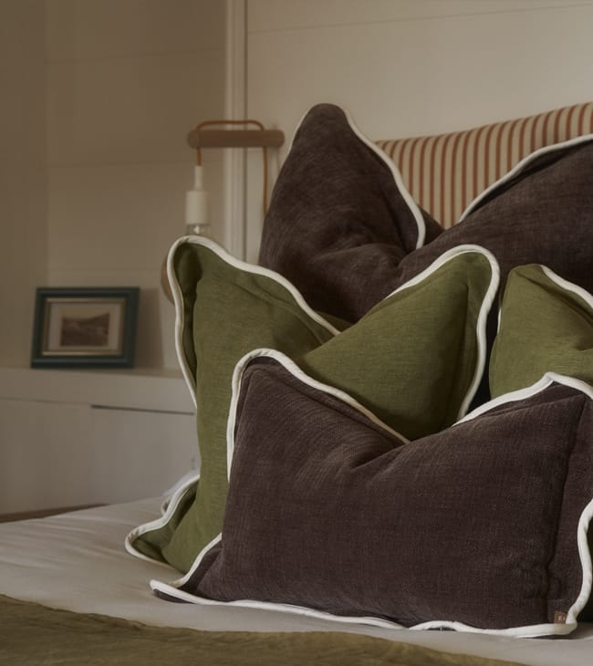 Bed cushions inside a dog-friendly hotel room at The Lodge Lulworth Cove