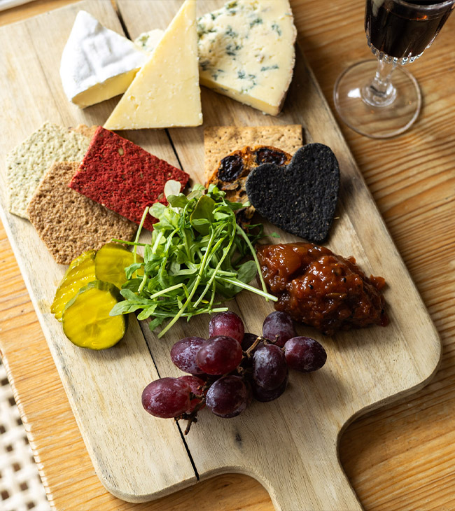 Charcuterie board featuring local Dorset meats, cheeses, fruits and accompaniments served at The Lodge at Lulworth.