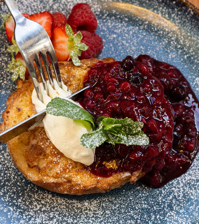 Enjoy a classic cream tea at the Lodge at Lulworth, with creamy clotted cream and sweet strawberry jam.