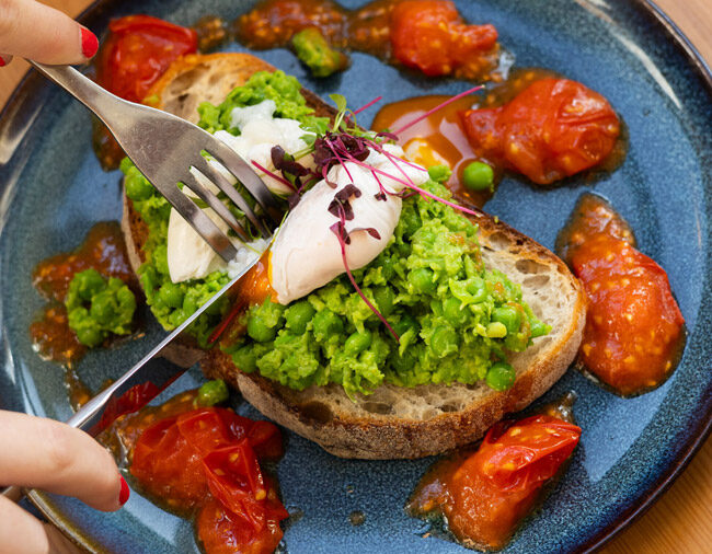 Poached eggs and avocado on sourdough toast served for breakfast at the Lodge at Lulworth.