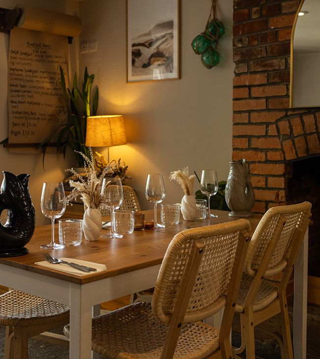 Relaxed indoor restaurant setting at The Lodge at Lulworth on the Jurassic Coast.